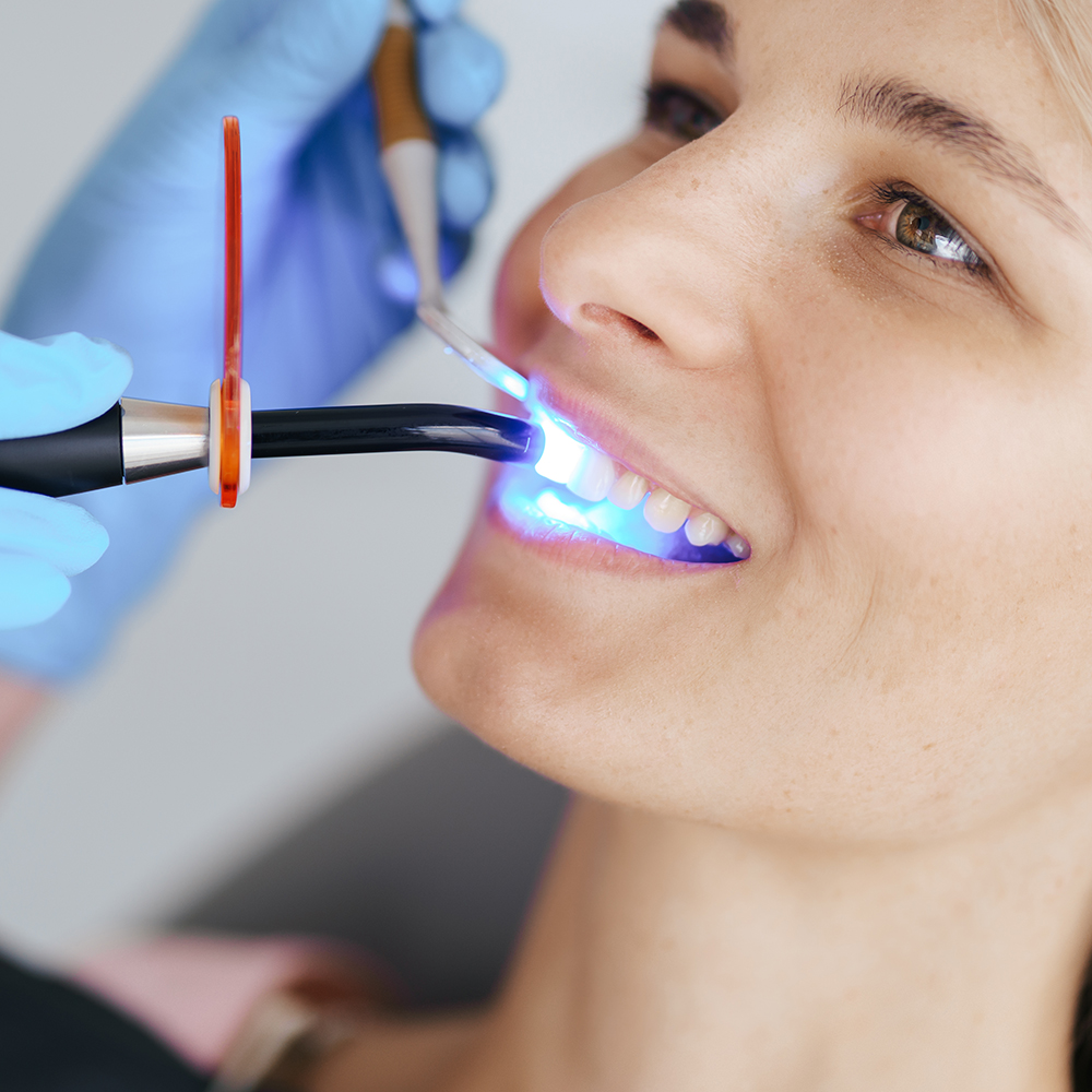 dentist hands using dental uv curing light led las 2021 09 04 06 37 50 utc copy